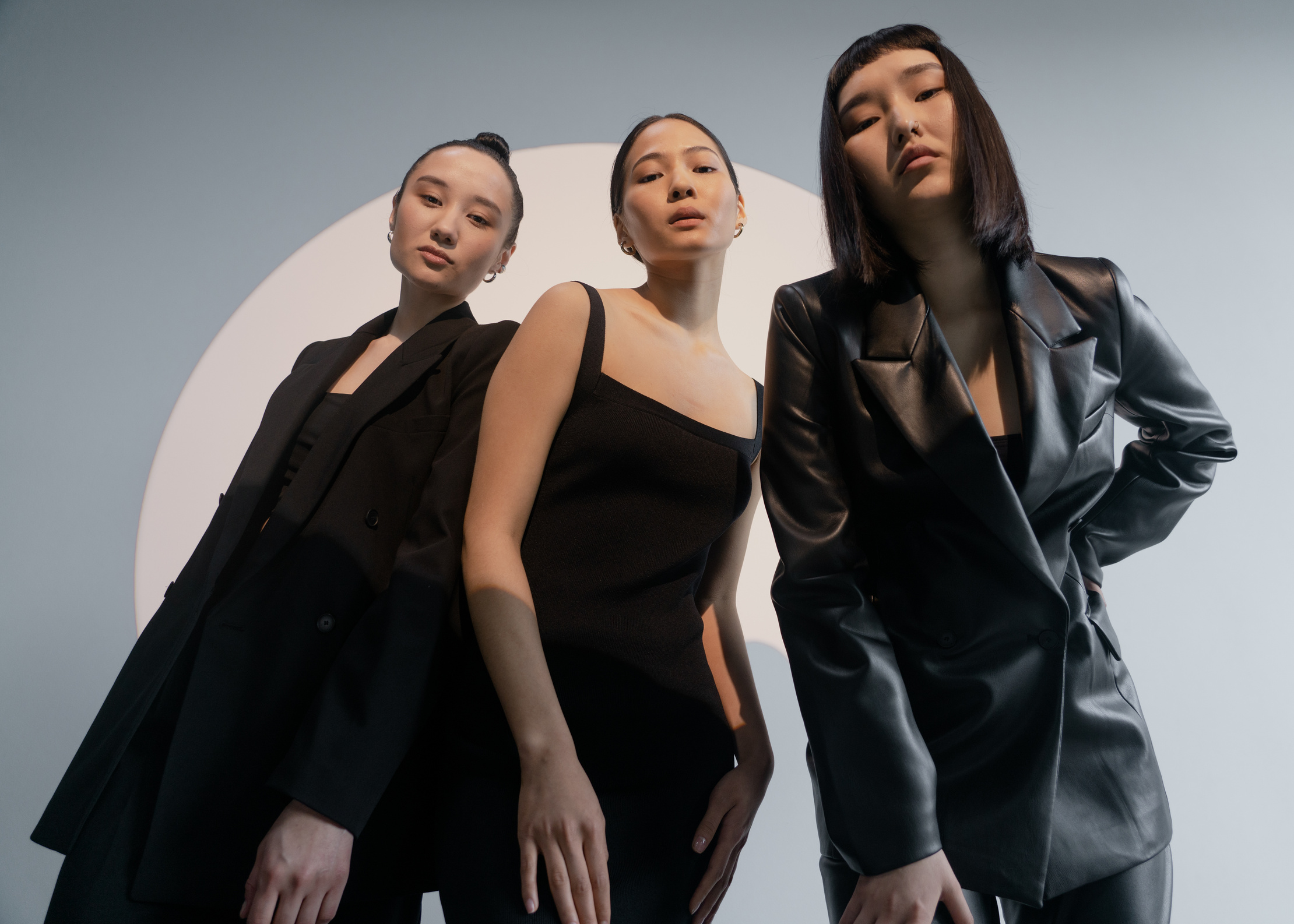Three Women Posing While wearing Black Clothes